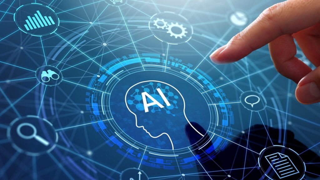 AIの文字が入った人型シルエットを中心に歯車や検索などのアイコンが青く光るデジタルイメージへ手元が指先で触れている写真