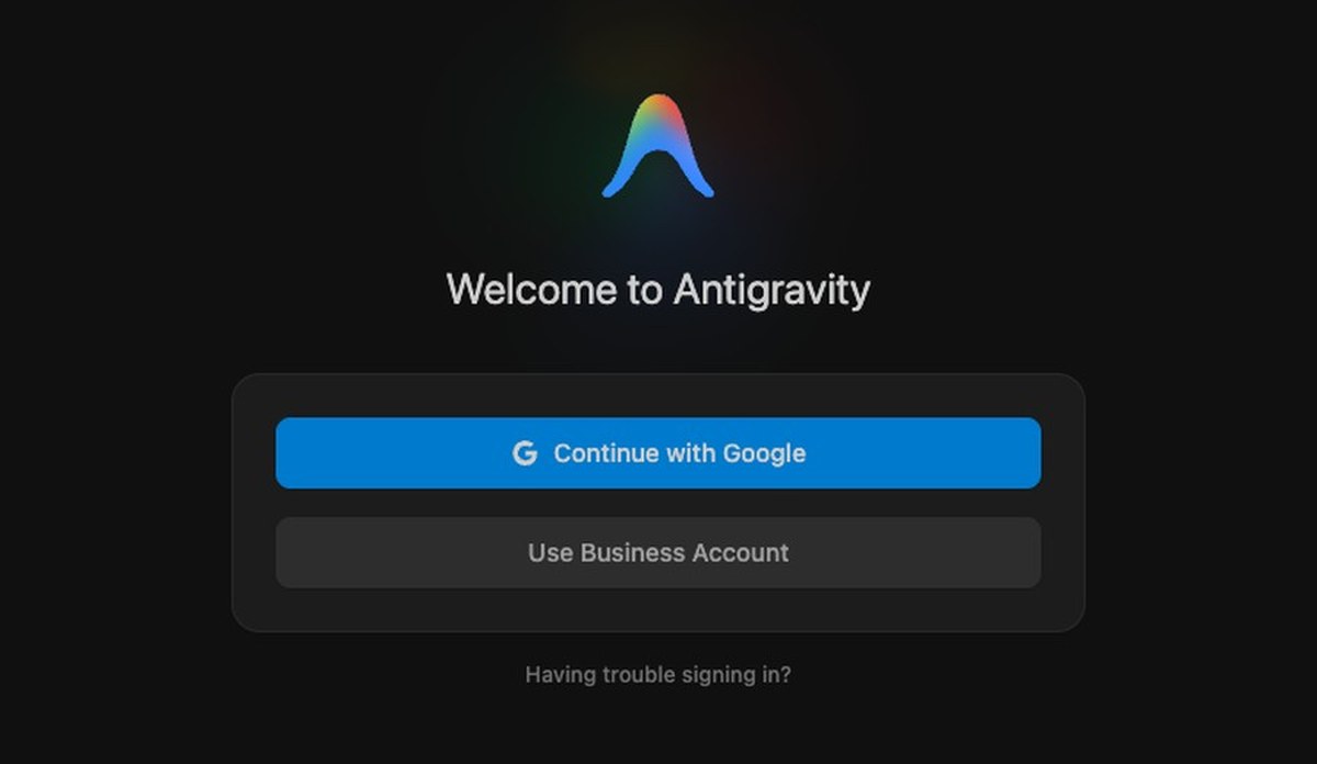黒い画面の中央にAntigravityの山形のアイコンとWelcome to Antigravityの文字、その下にContinue with Googleの青いボタンとUse Business Accountのボタンが並んでいる