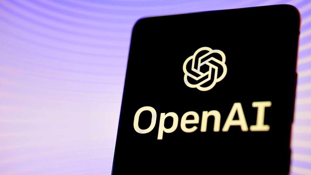 紫色の背景の前でスマートフォンの画面にOpenAIのロゴマークと文字が表示されている写真。OpenAI、dotsで日本は世界2位 月20ドルのPlusは対象外だ
